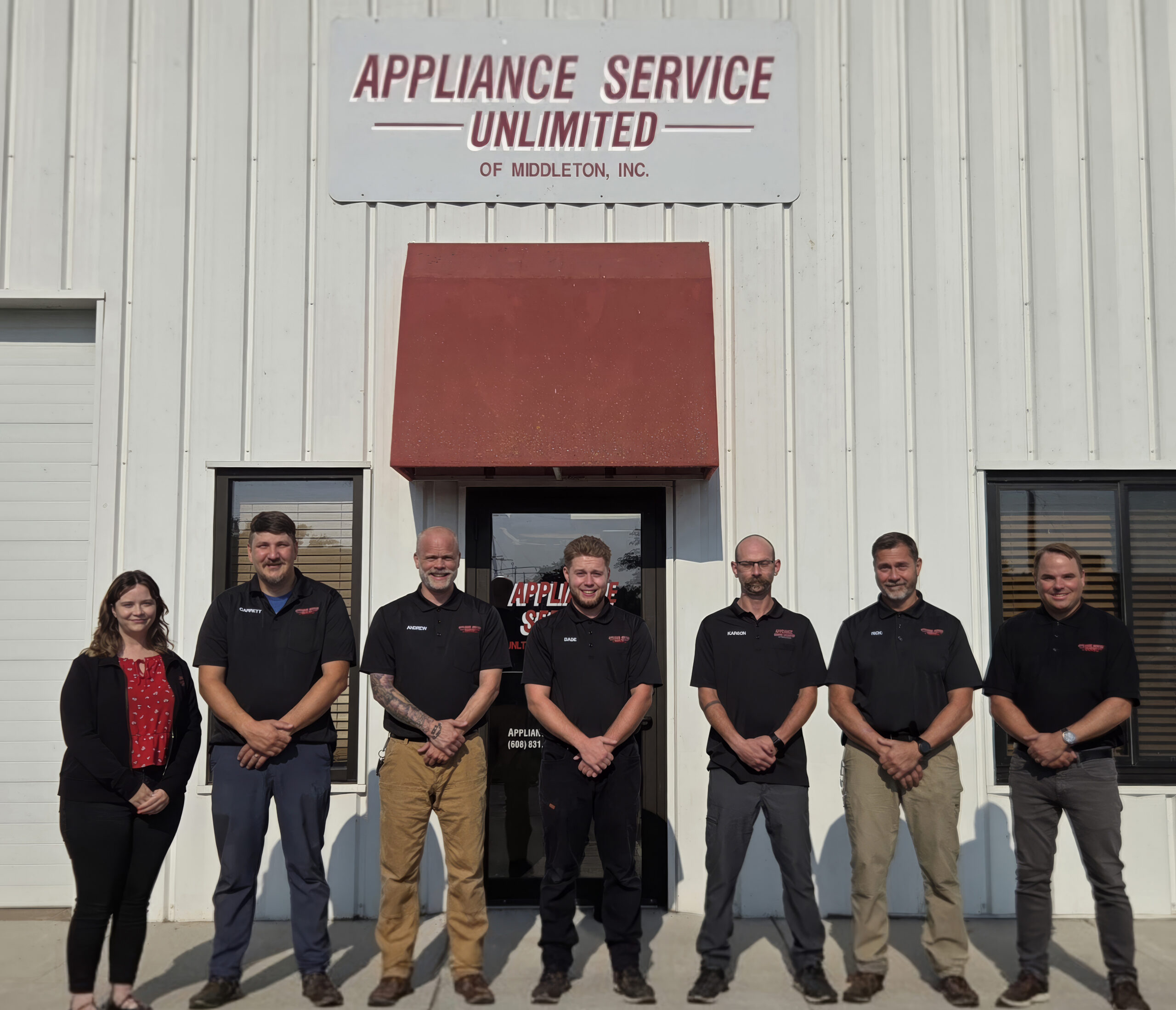 Appliance Service Unlimited staff standing outside office building